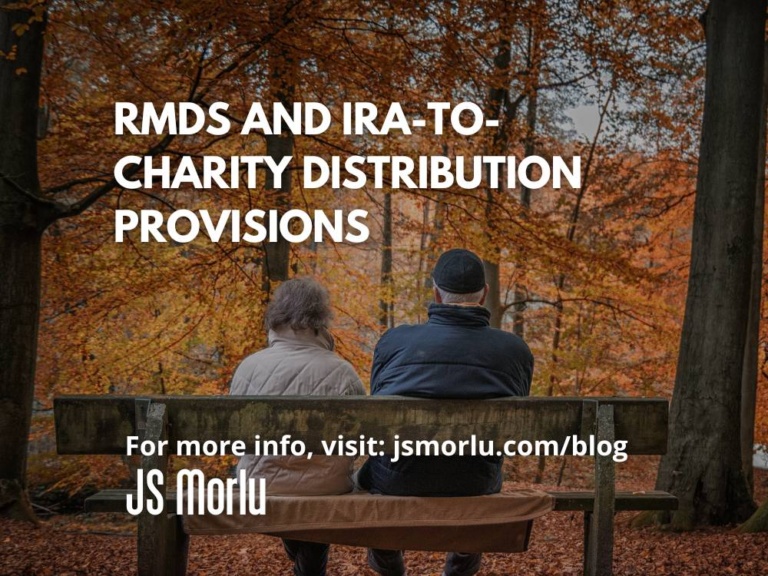 An elderly couple sits on a bench in the park, surrounded by colorful autumn foliage - RMDS and IRA to charity distribution