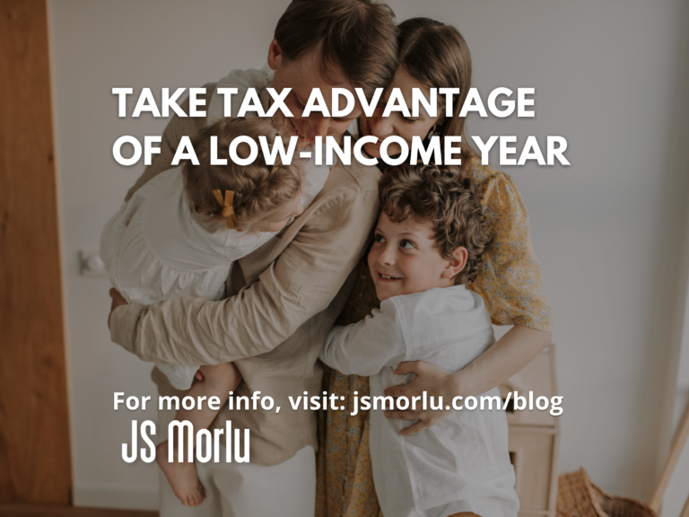 Two children embraced by their parents in a warm hug - Take tax advantage of a low-income year