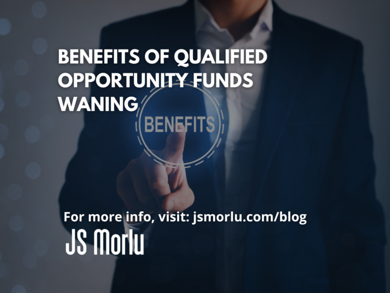 Image of a professional man pointing at a screen displaying the benefits - Qualified Opportunity Funds.