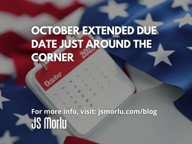 A vibrant red, white, and blue American flag proudly serves as the backdrop for an open calendar, showcasing the month of October - tax due date.