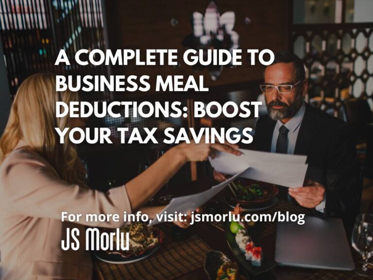 Businessman and businesswoman sitting at a table, sharing a meal while discussing projects. The woman holds papers as they talk - Business Meal Deductions