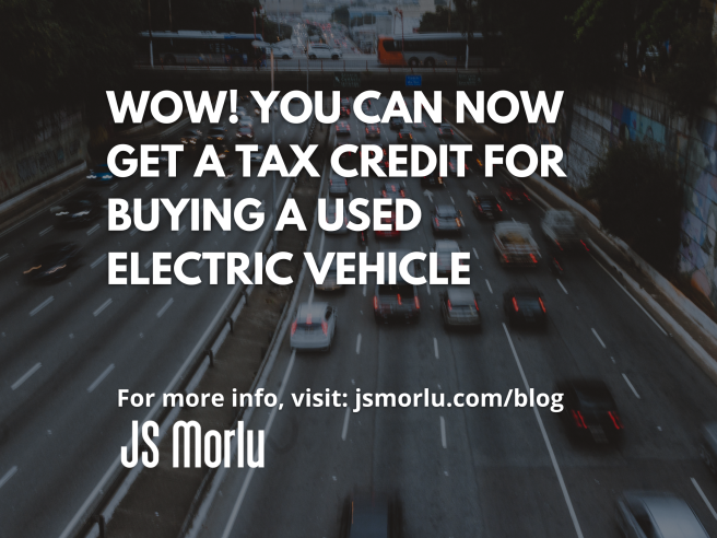 An aerial view of cars moving along a busy highway - Tax Credit/ Used Electric Vehicle.