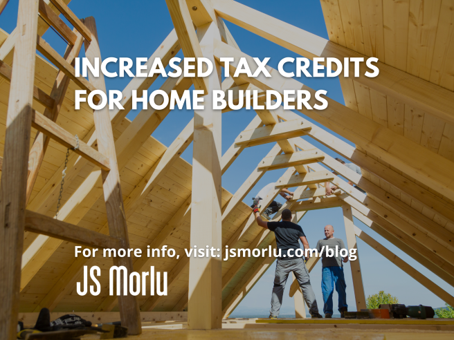 Two men engaged in a discussion outdoors, examining a recently constructed house - tax credits.