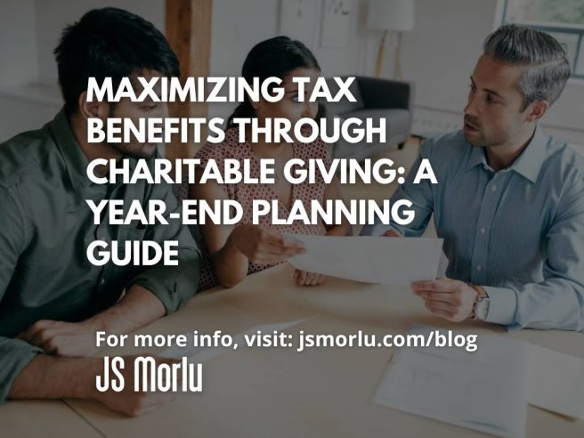 A group of people sitting at a table looking at a piece of paper - Charitable giving